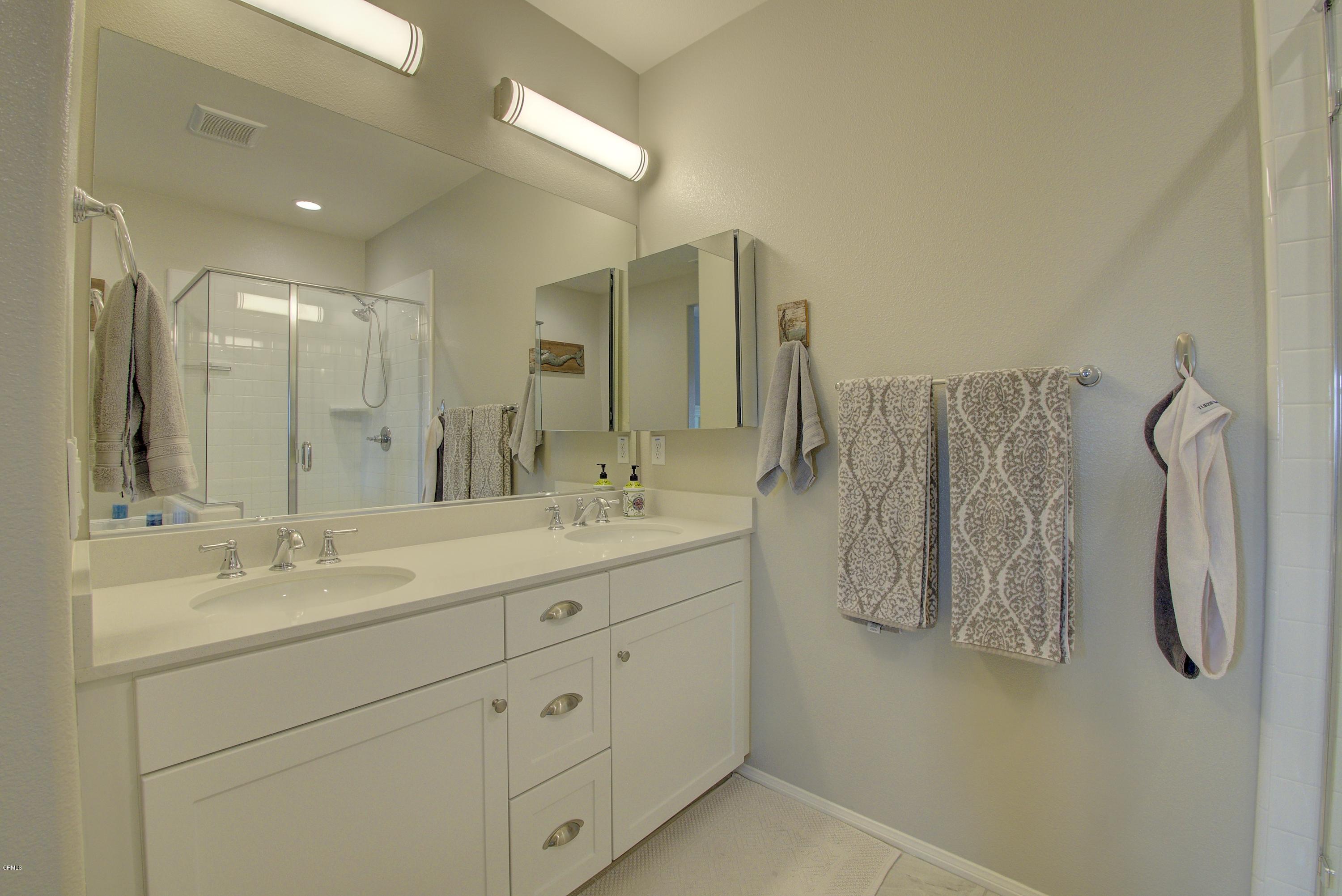 178 Prairie Street Camarillo, CA 93010 - Photo 52 of 74 a bathroom with a double vanity sink mirror and shower