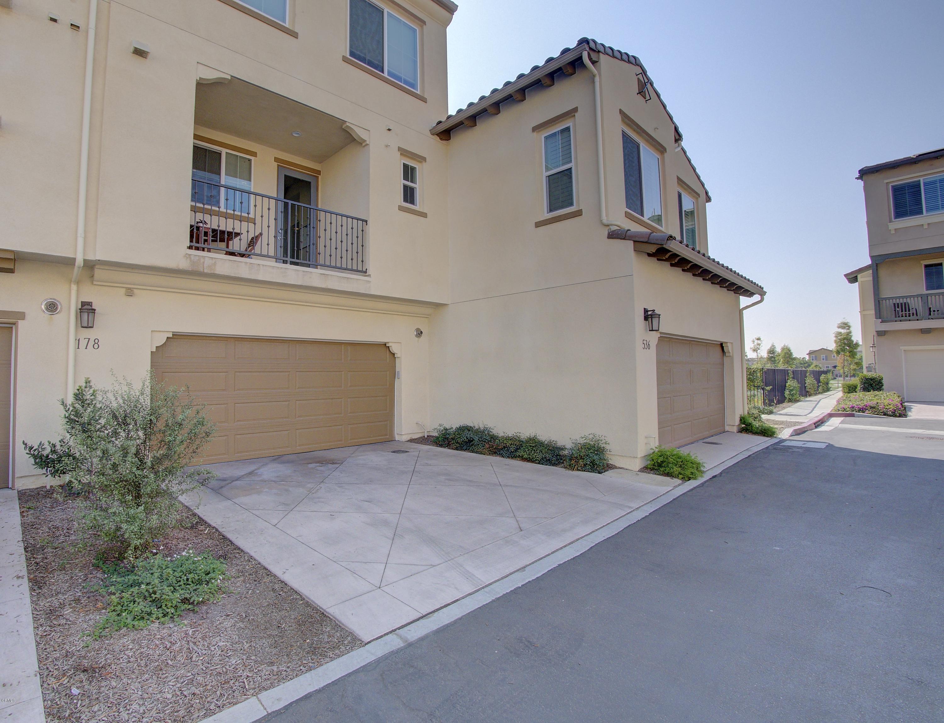 178 Prairie Street Camarillo, CA 93010 - Photo 63 of 74 a front view of a house with a yard and garage