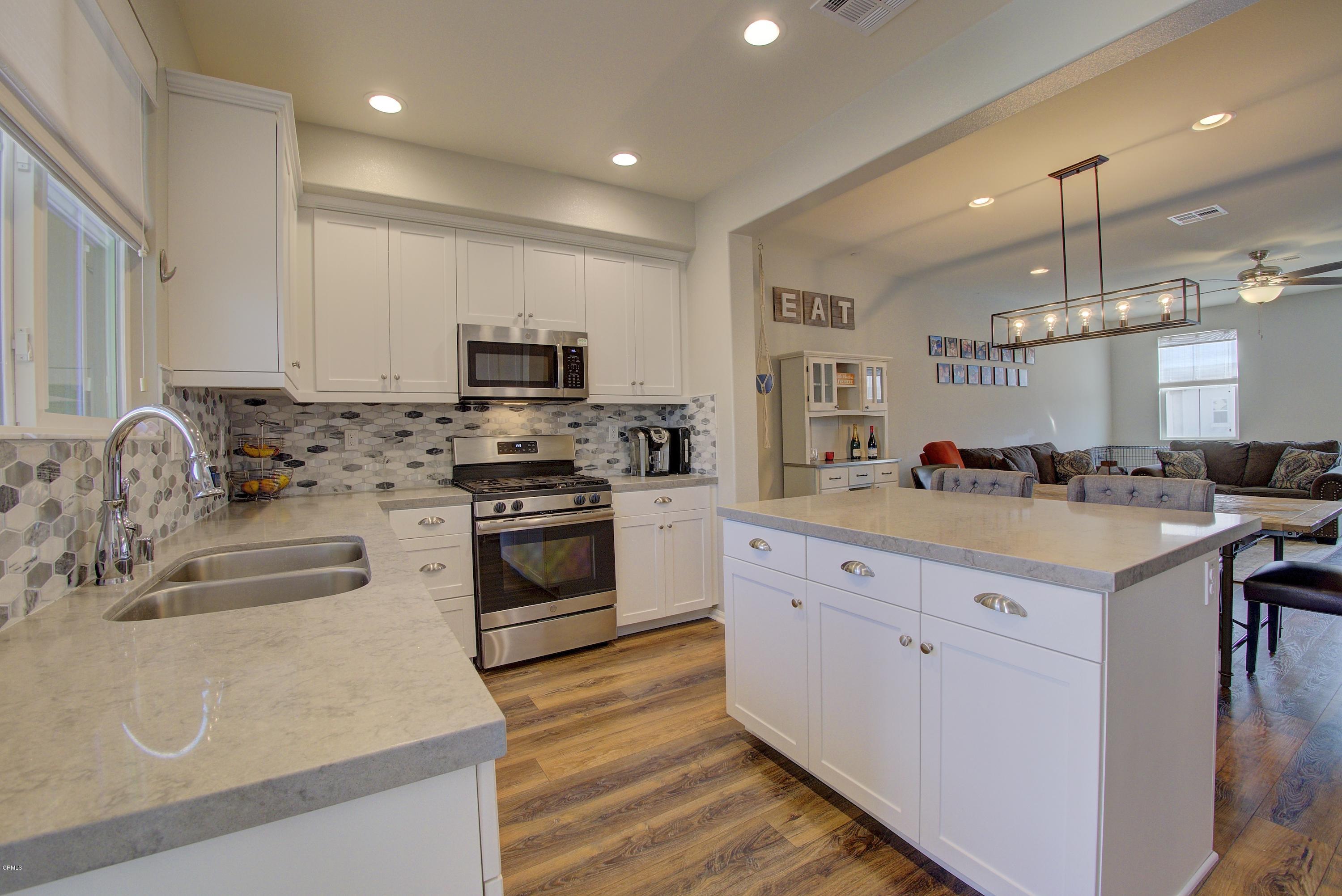 178 Prairie Street Camarillo, CA 93010 - Photo 8 of 74 a kitchen with granite countertop a stove and a sink