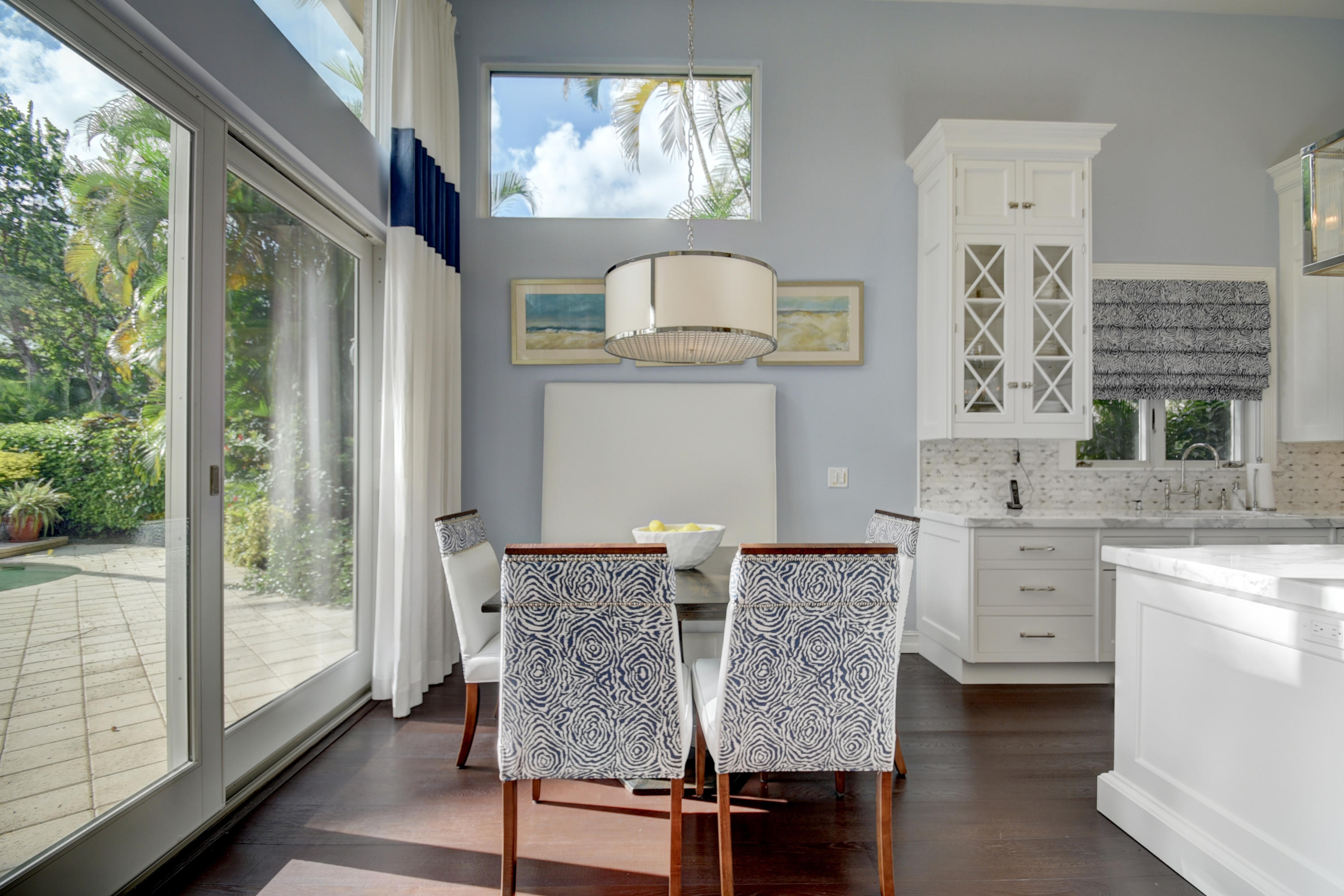 4191 Briarcliff Circle Boca Raton, FL 33496 - Photo 15 of 37 a room with a table chairs and chandelier