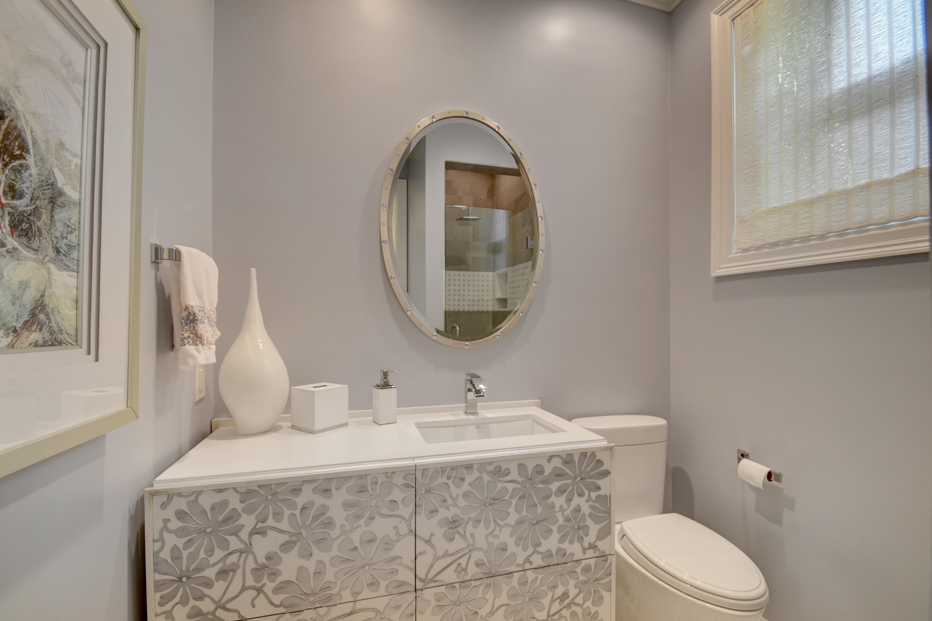 4191 Briarcliff Circle Boca Raton, FL 33496 - Photo 25 of 37 a bathroom with a toilet sink and mirror