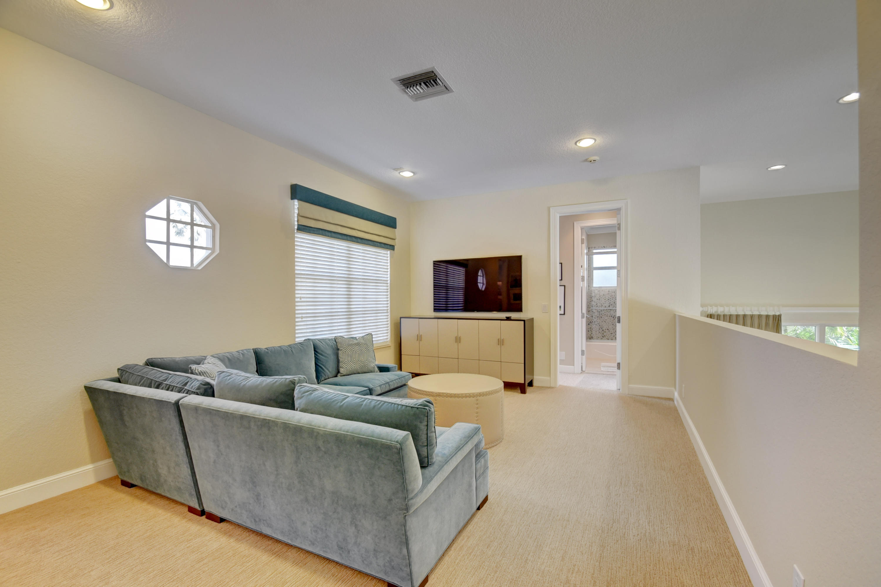 4191 Briarcliff Circle Boca Raton, FL 33496 - Photo 27 of 37 a living room with furniture and a flat screen tv