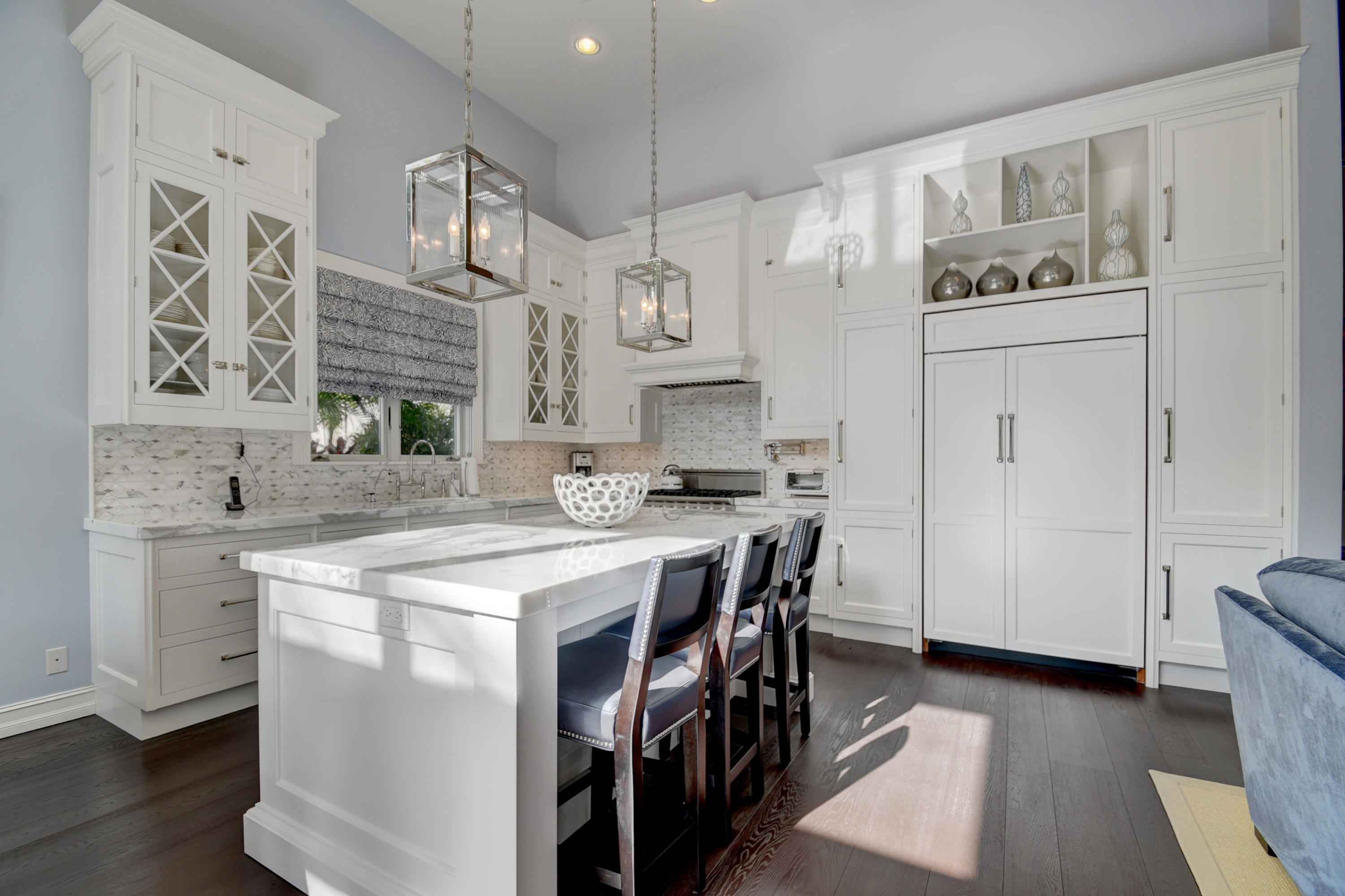 4191 Briarcliff Circle Boca Raton, FL 33496 - Photo 8 of 37 a kitchen with cabinets and wooden floor