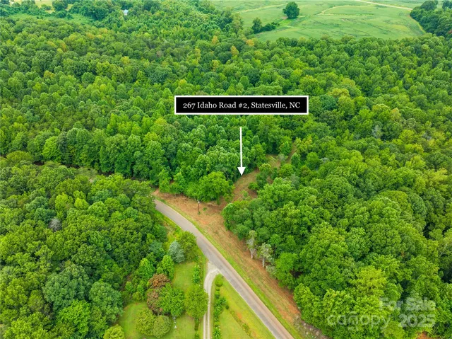 a view of a sign in a lush green field
