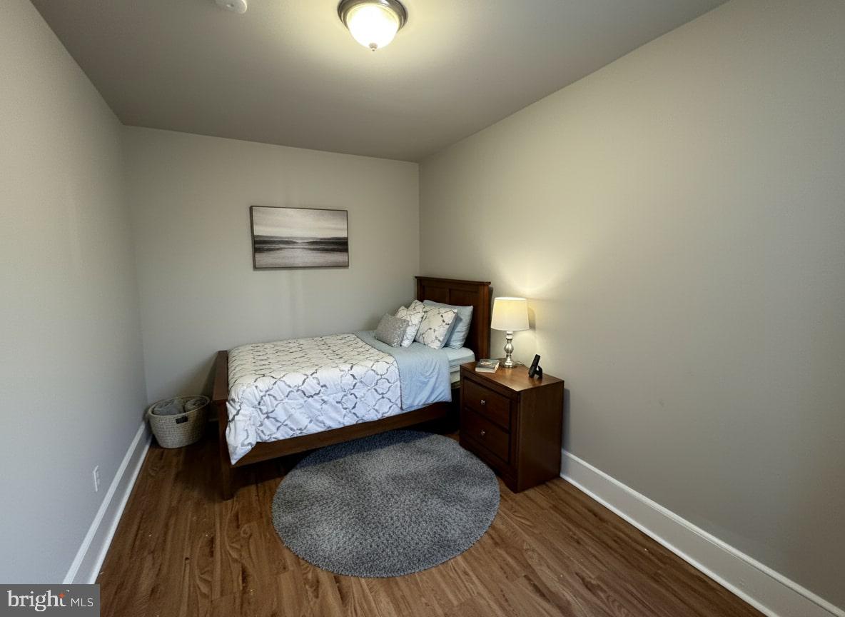 211 South Millick Street Philadelphia, PA 19139 - Photo 5 of 7 a bedroom with a bed and window