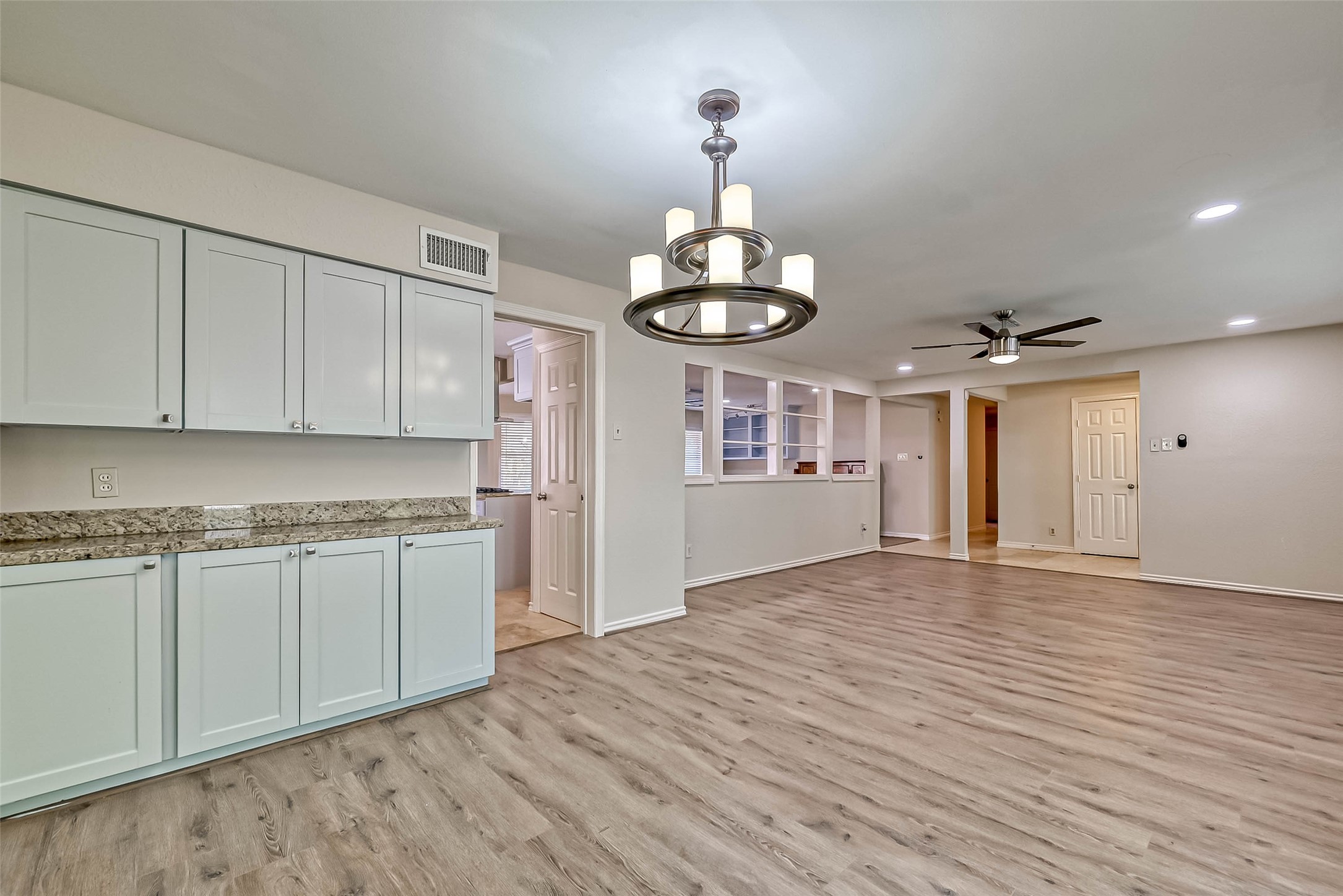 9707 Kit Street Houston, TX 77096 - Photo 11 of 45 a view of a kitchen with a sink and dishwasher a refrigerator with wooden floor