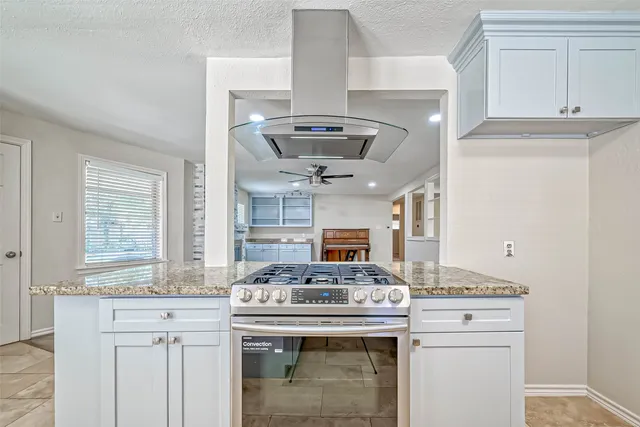 a kitchen with a stove and a sink