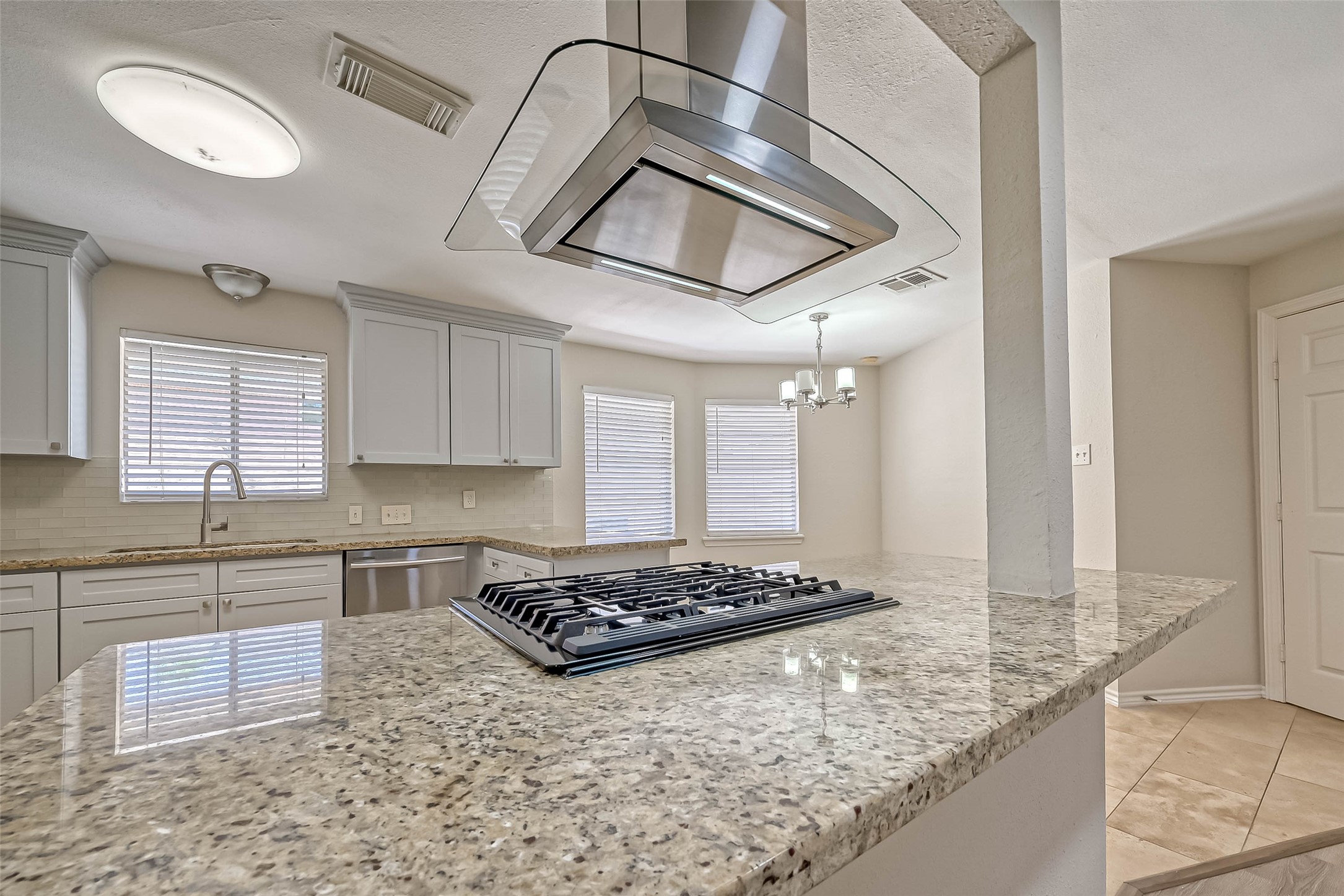 9707 Kit Street Houston, TX 77096 - Photo 20 of 45 a kitchen with stainless steel appliances granite countertop a stove a sink and a granite counter tops