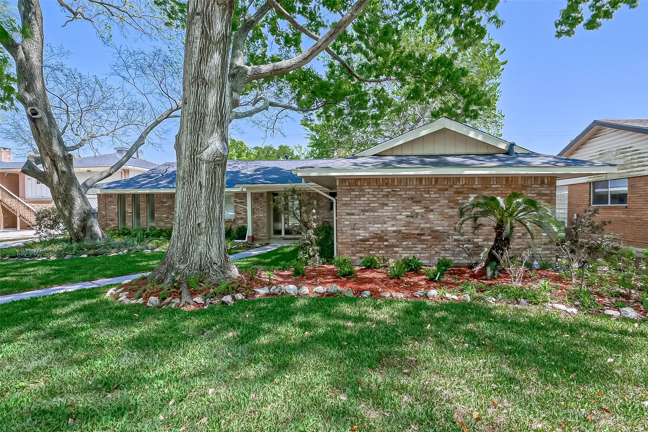 9707 Kit Street Houston, TX 77096 - Photo 2 of 45 a front view of a house with a yard
