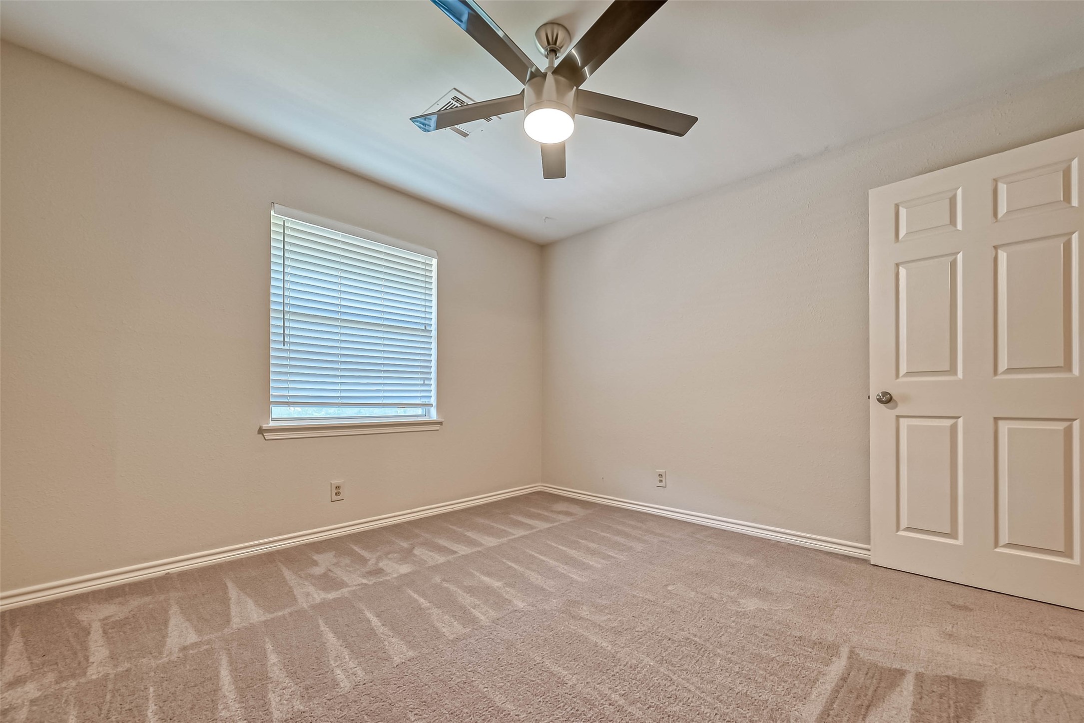 9707 Kit Street Houston, TX 77096 - Photo 24 of 45 a view of an empty room with a window