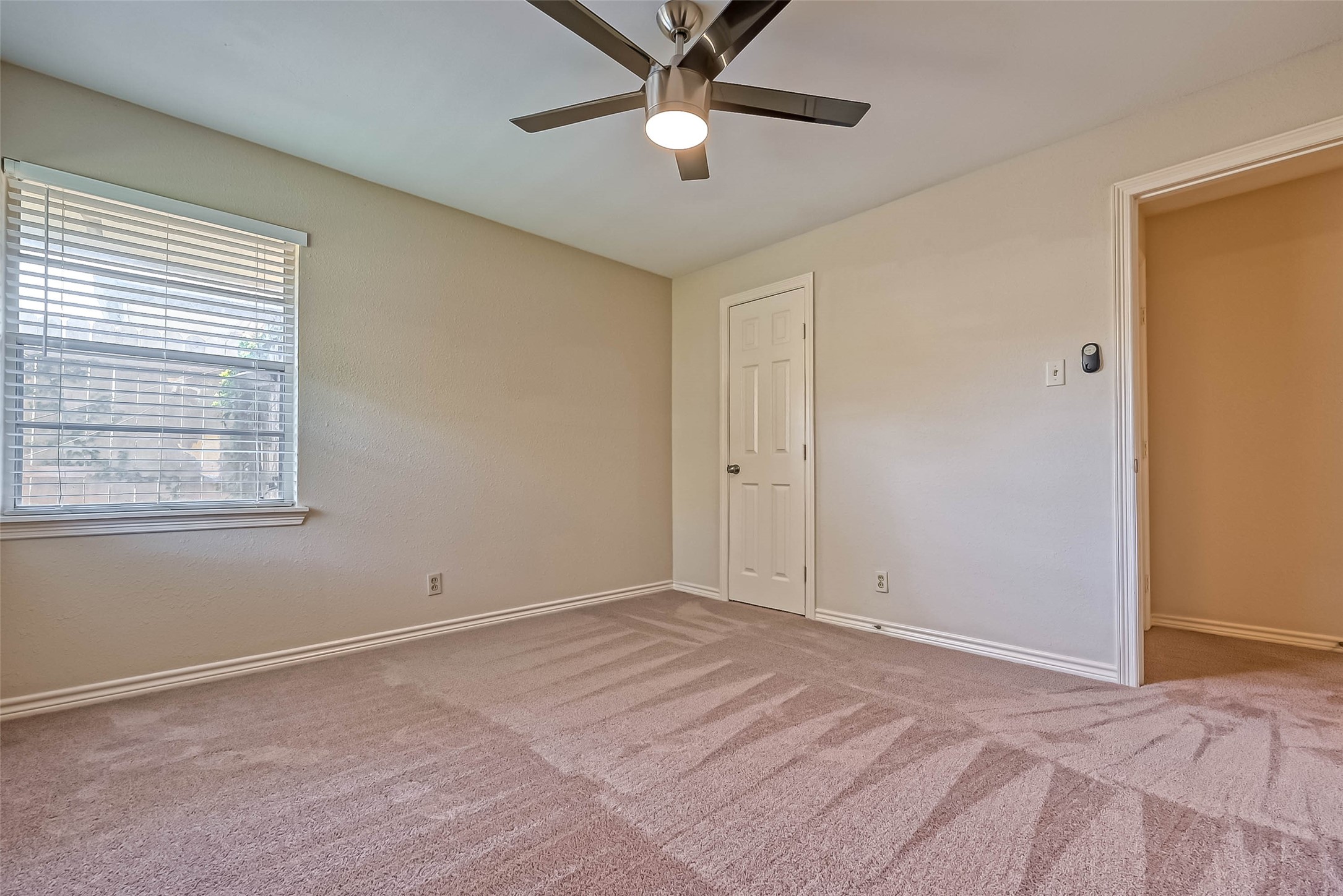 9707 Kit Street Houston, TX 77096 - Photo 25 of 45 a view of room with window and ceiling fan