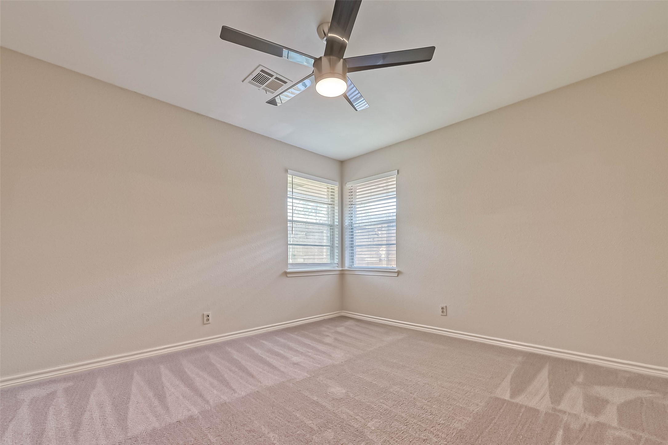 9707 Kit Street Houston, TX 77096 - Photo 26 of 45 an empty room with a window and a fan