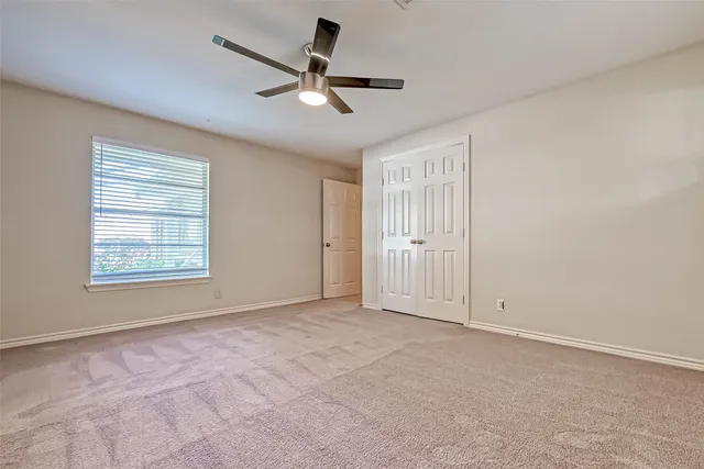 a bathroom with a double vanity sink toilet and a mirror
