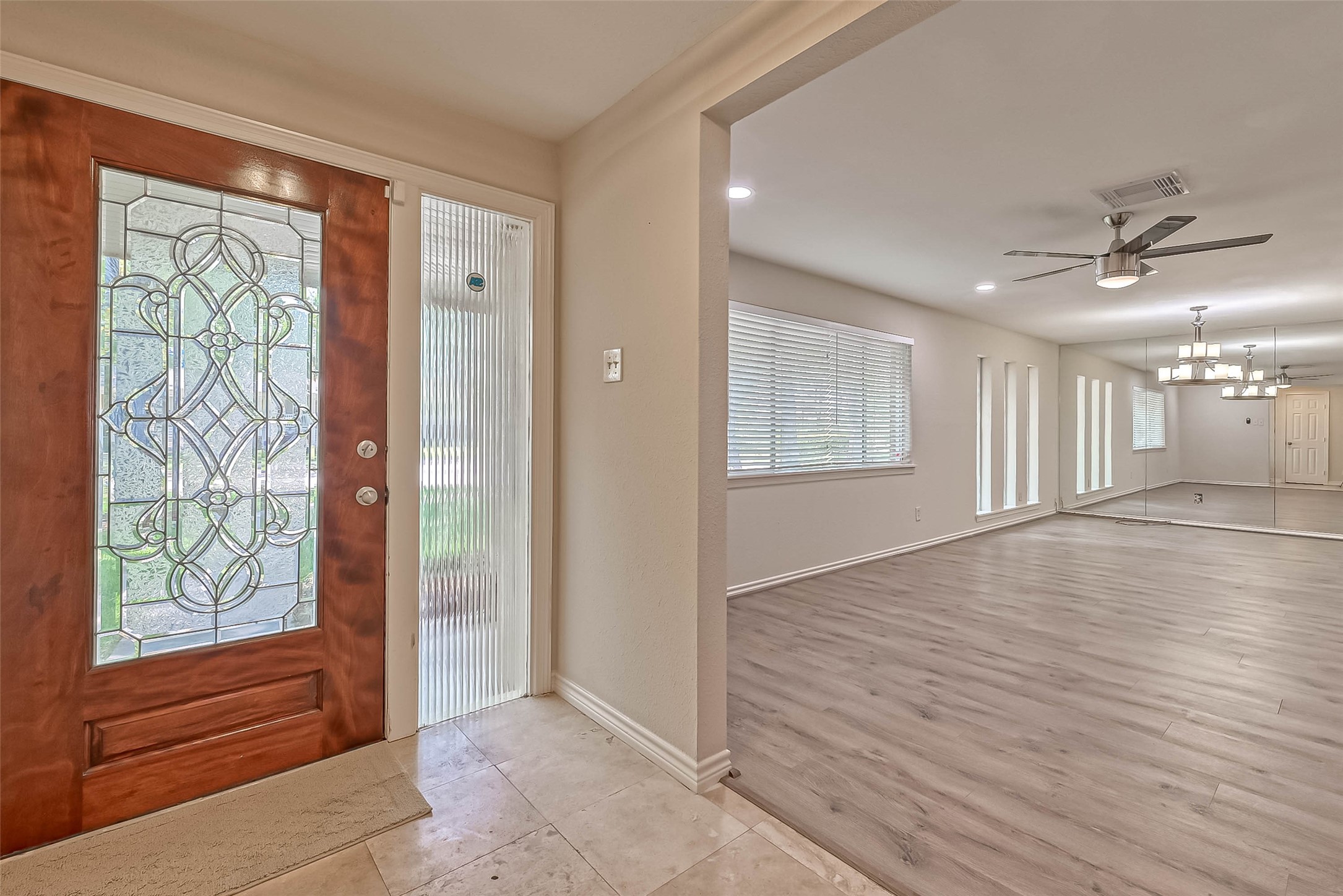9707 Kit Street Houston, TX 77096 - Photo 6 of 45 an empty room with wooden floor and windows
