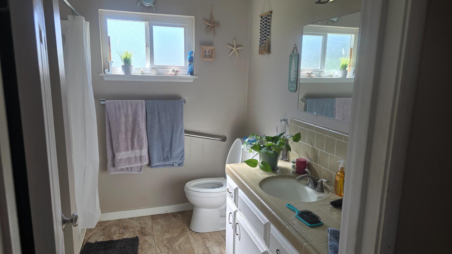 11592 Peoria Road Browns Valley, CA 95918 - Photo 35 of 49 a bathroom with a sink toilet and window