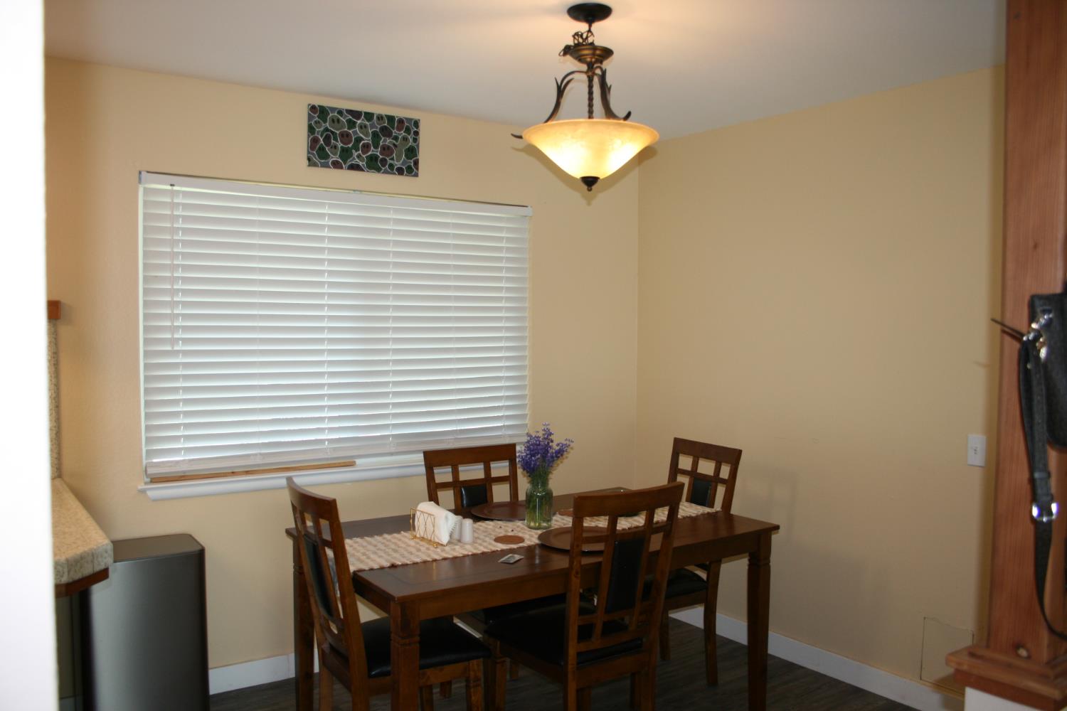 11592 Peoria Road Browns Valley, CA 95918 - Photo 40 of 49 a view of a dining room with furniture and chandelier