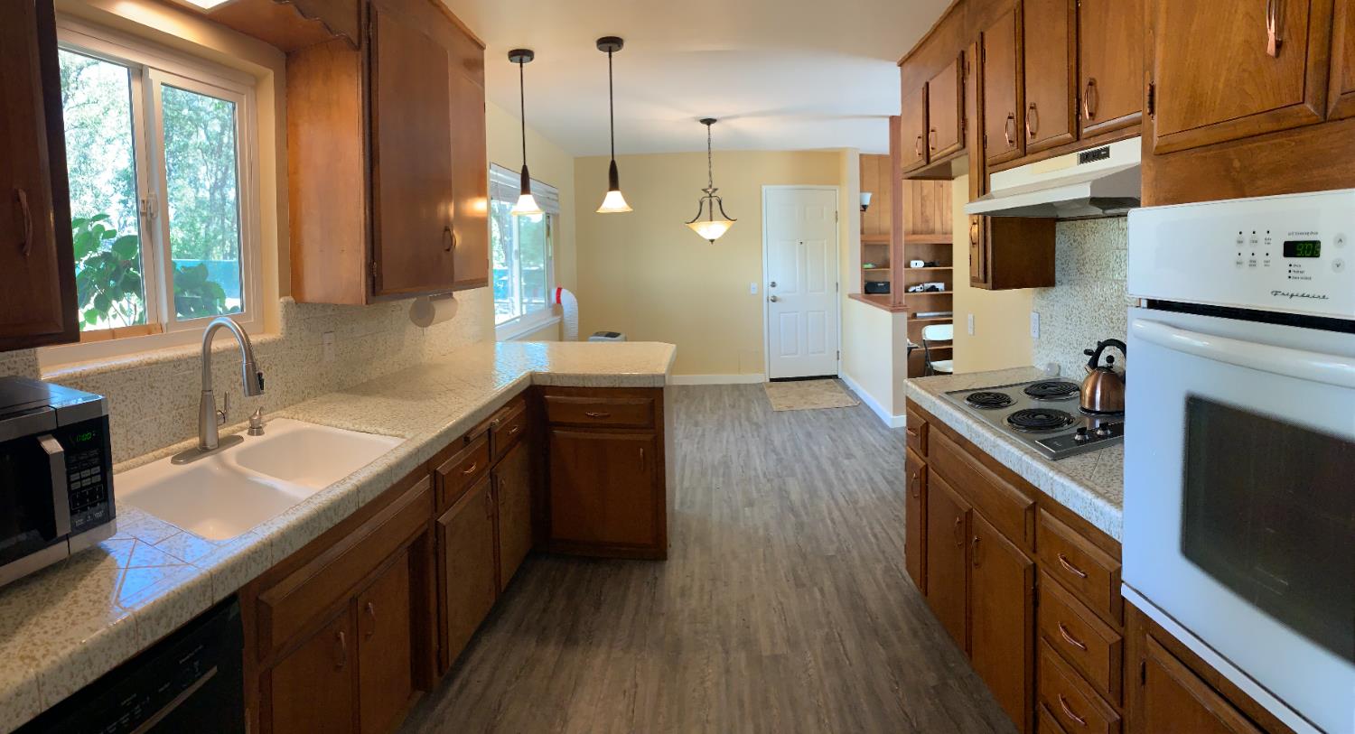11592 Peoria Road Browns Valley, CA 95918 - Photo 4 of 49 a kitchen with stainless steel appliances a sink stove and cabinets