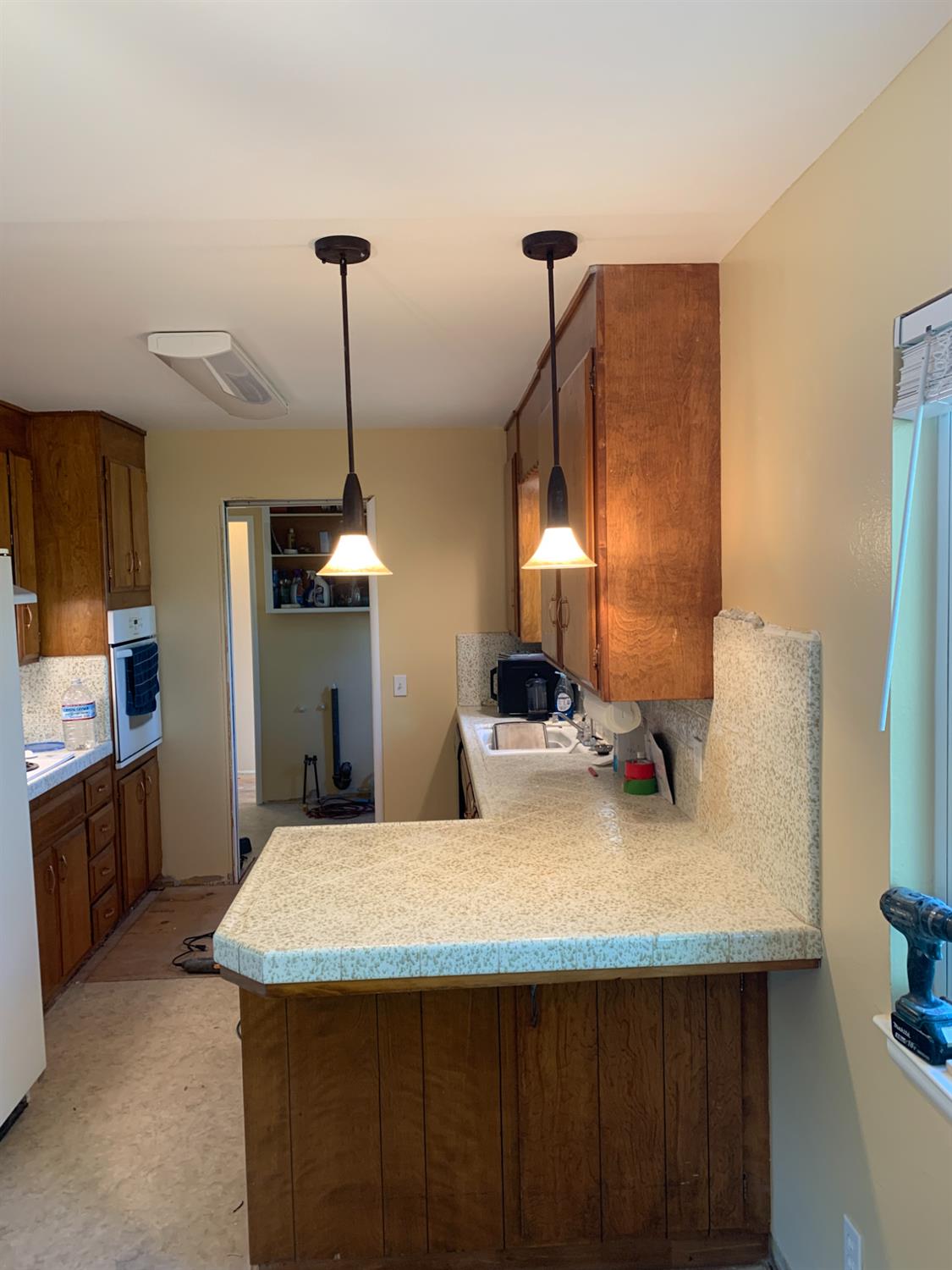 11592 Peoria Road Browns Valley, CA 95918 - Photo 45 of 49 a kitchen with a sink a counter space and a dining table