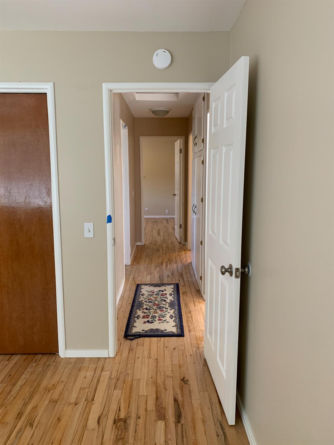 11592 Peoria Road Browns Valley, CA 95918 - Photo 47 of 49 a view of a hallway view with wooden floor and a bathroom sink