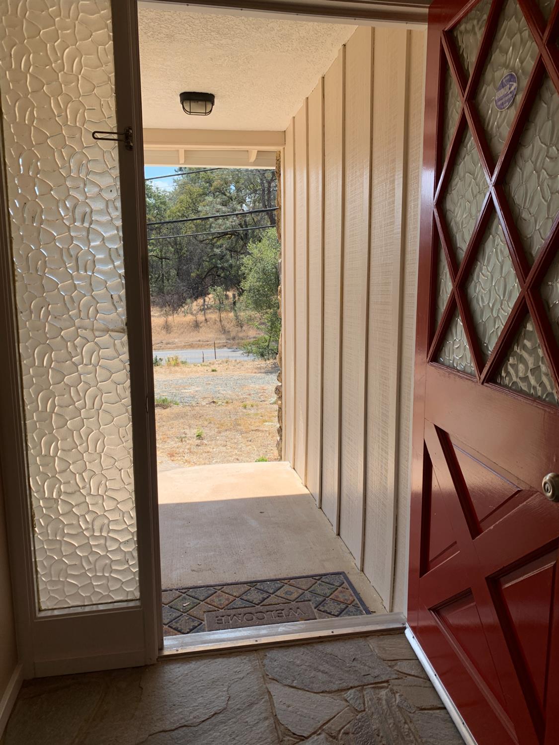 11592 Peoria Road Browns Valley, CA 95918 - Photo 48 of 49 a view of an empty room with wooden floor and a window