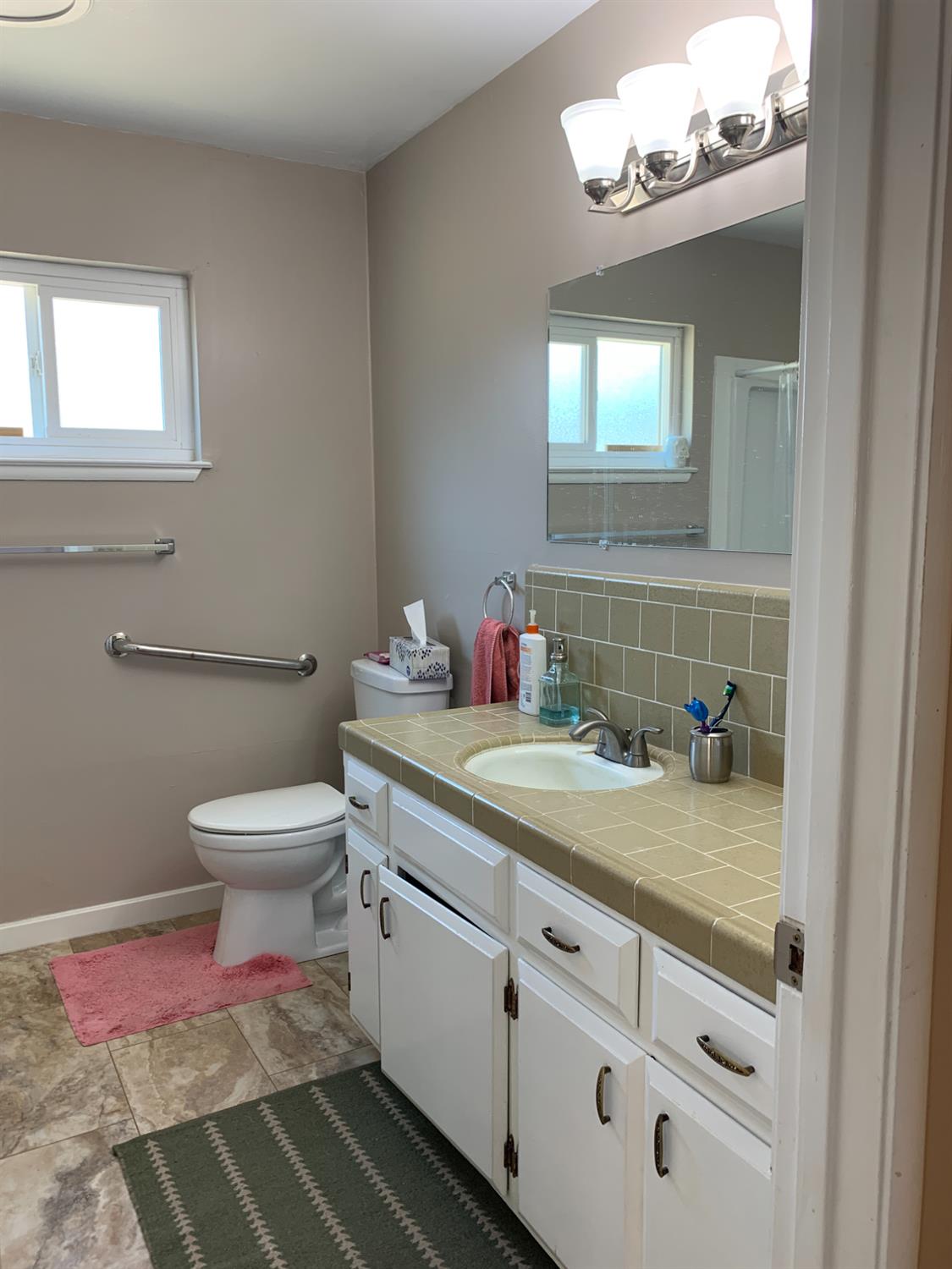 11592 Peoria Road Browns Valley, CA 95918 - Photo 5 of 49 a bathroom with a granite countertop toilet sink and mirror