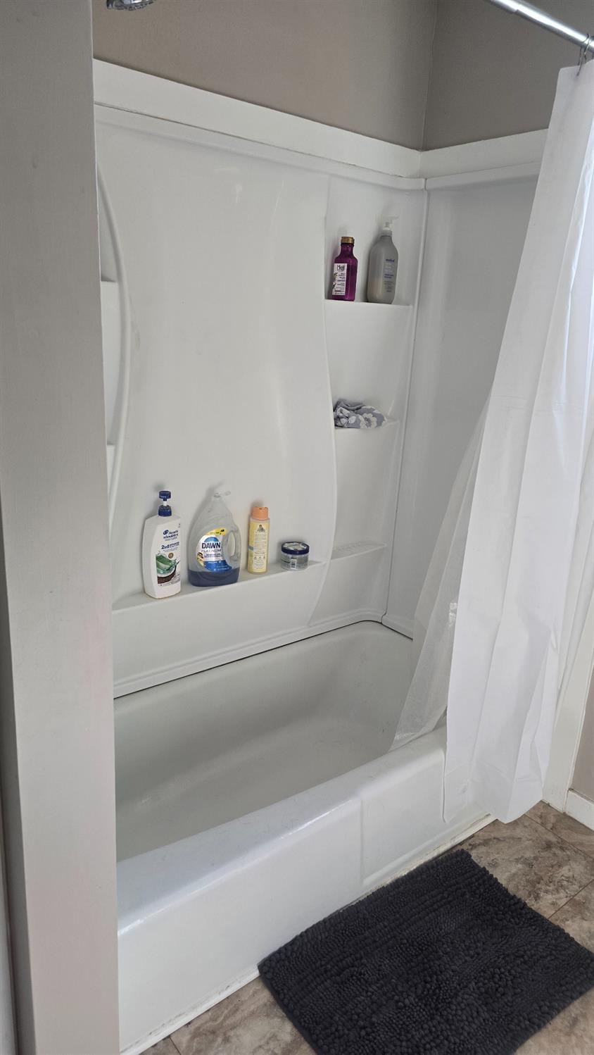 11592 Peoria Road Browns Valley, CA 95918 - Photo 6 of 49 a bathroom with a bathtub and shower