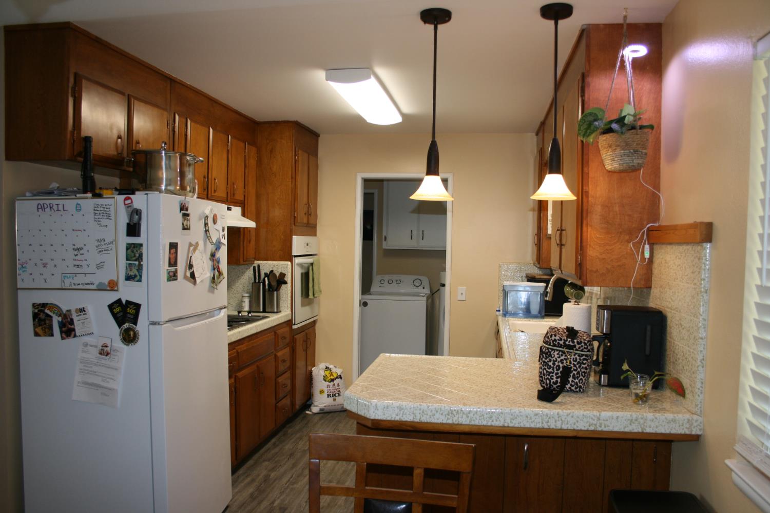 11592 Peoria Road Browns Valley, CA 95918 - Photo 7 of 49 a kitchen with cabinets and refrigerator