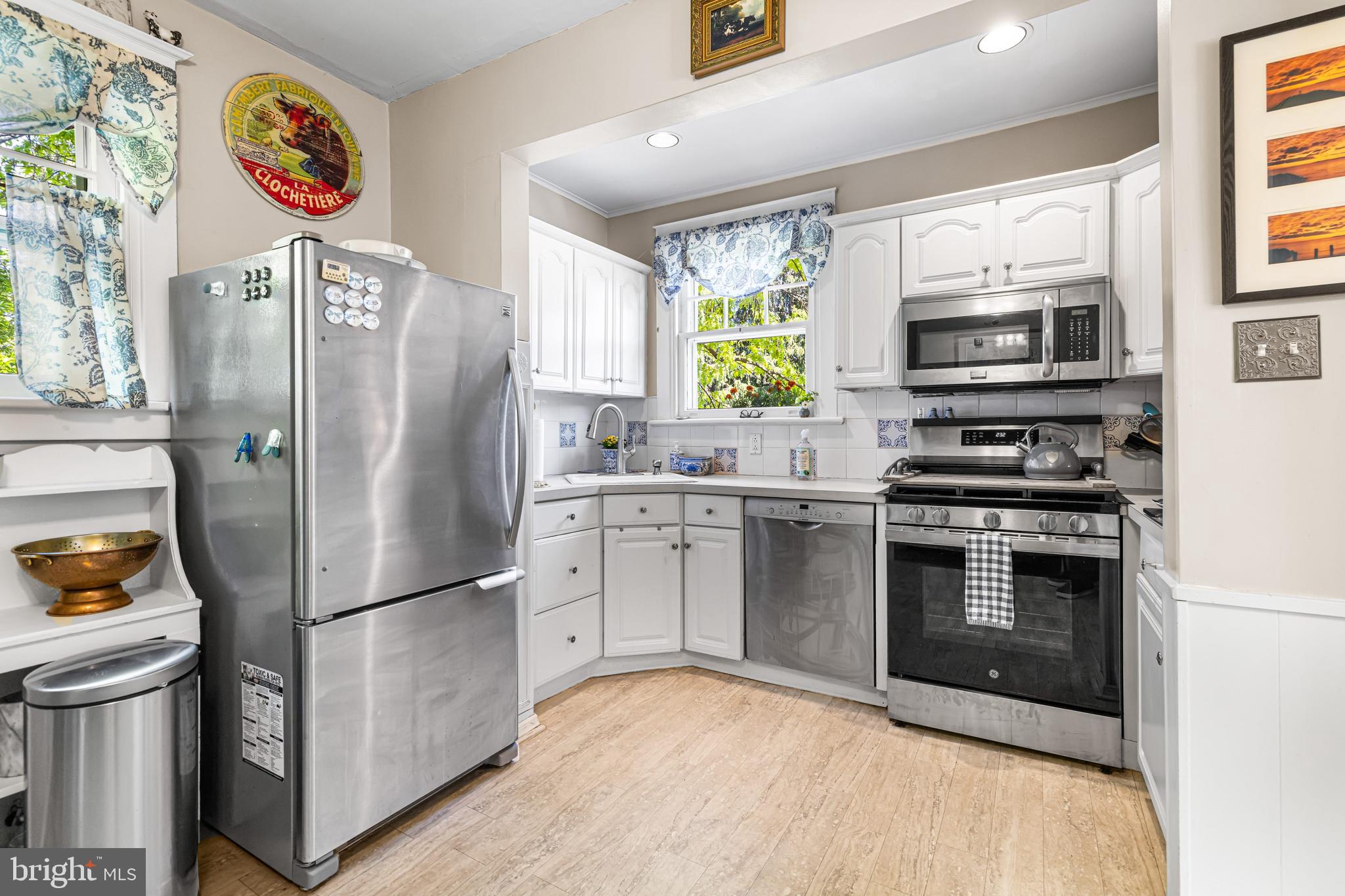 715 North Easton Road Glenside, PA 19038 - Photo 12 of 59 a kitchen with stainless steel appliances granite countertop a refrigerator sink and stove