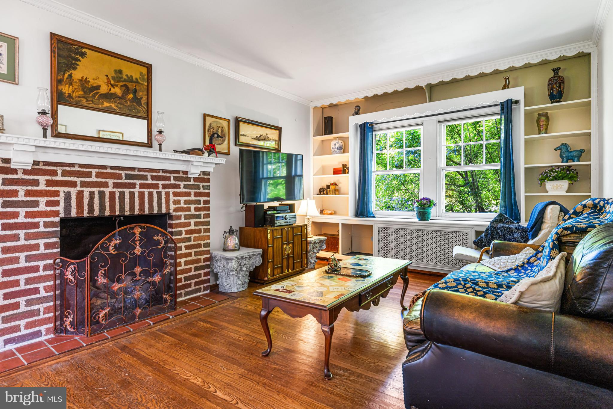 715 North Easton Road Glenside, PA 19038 - Photo 18 of 59 a living room with furniture a fireplace and a table
