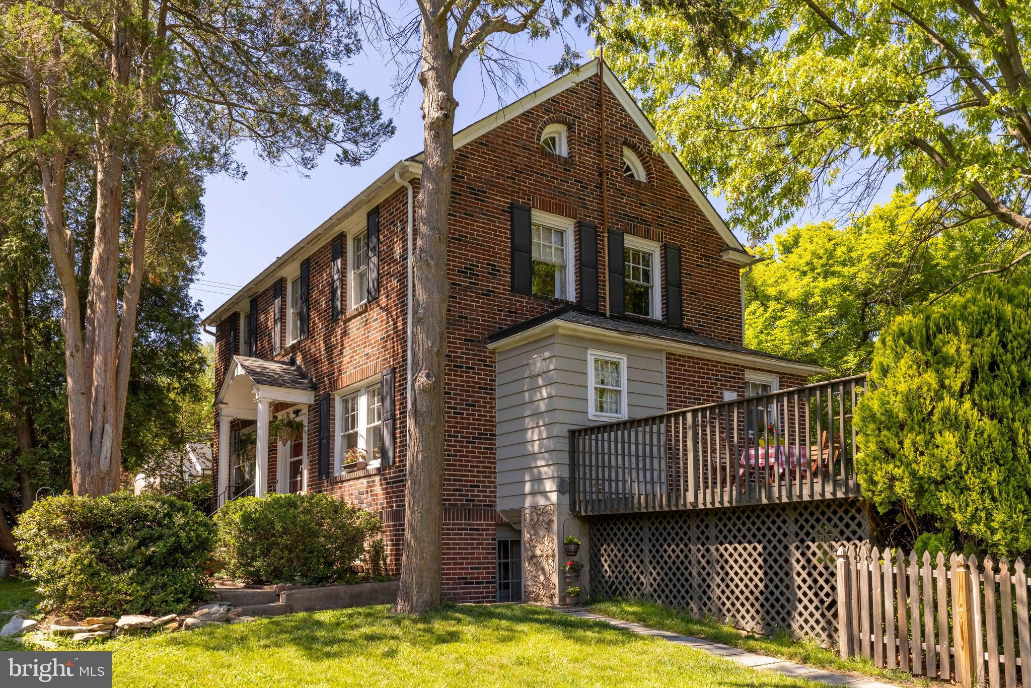 715 North Easton Road Glenside, PA 19038 - Photo 2 of 59 a view of a house with brick walls plants and large tree