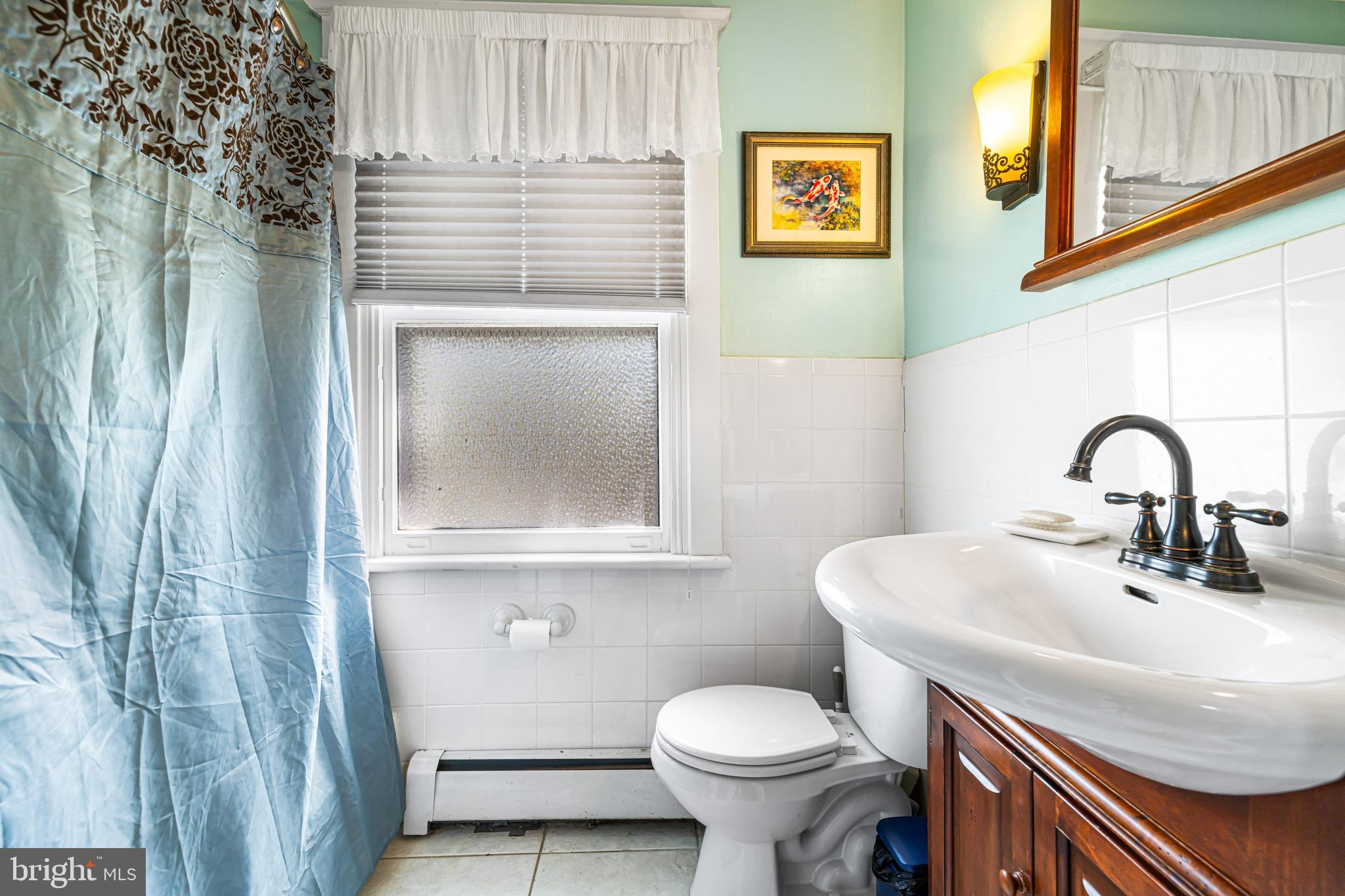 715 North Easton Road Glenside, PA 19038 - Photo 27 of 59 a bathroom with a sink and a toilet