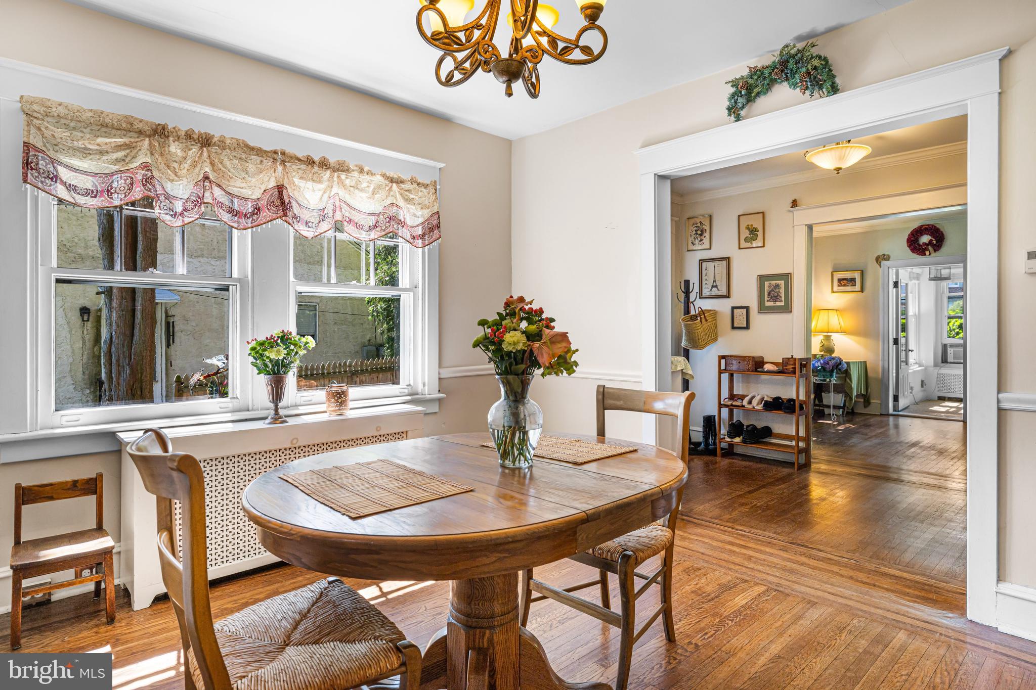 715 North Easton Road Glenside, PA 19038 - Photo 10 of 59 a view of a dining room with furniture a chandelier and wooden floor