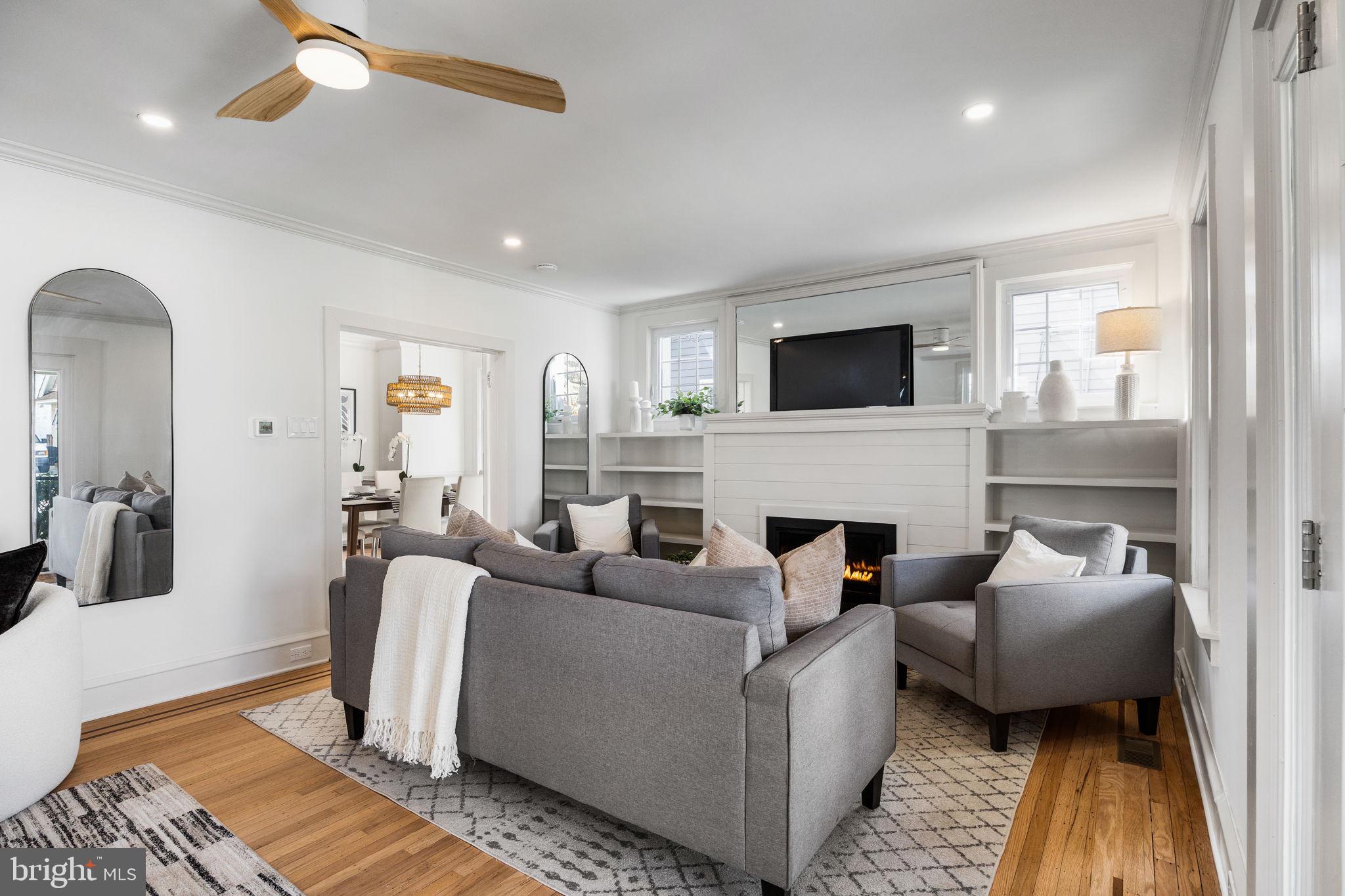 13 Princeton Road Havertown, PA 19083 - Photo 14 of 73 a living room with furniture a fireplace and a flat screen tv