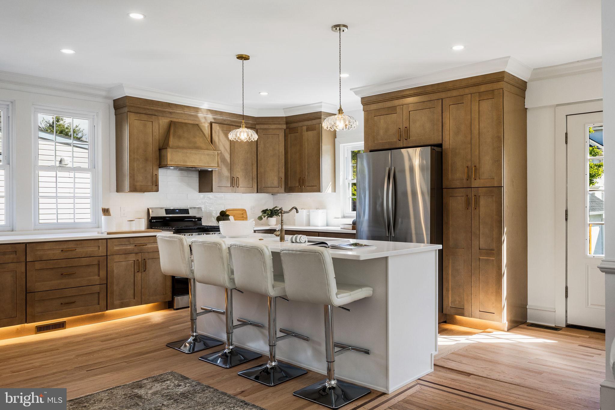 13 Princeton Road Havertown, PA 19083 - Photo 26 of 73 a kitchen with kitchen island granite countertop a sink appliances and cabinets