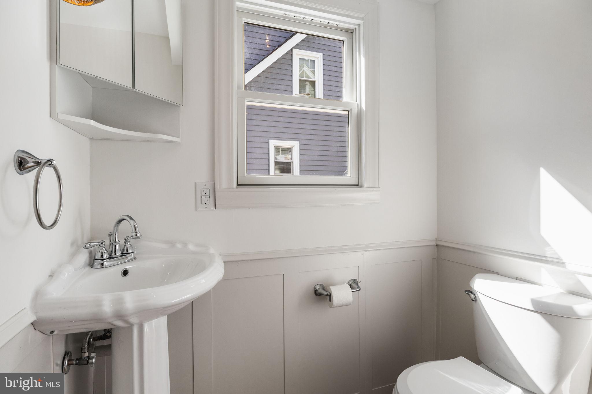 13 Princeton Road Havertown, PA 19083 - Photo 37 of 73 a bathroom with a sink a toilet and a mirror