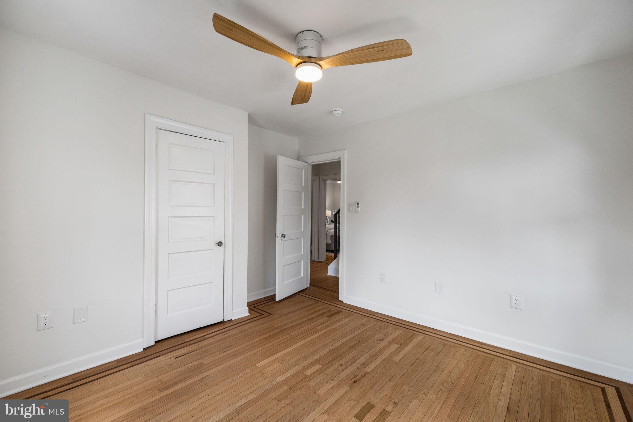 13 Princeton Road Havertown, PA 19083 - Photo 41 of 73 a view of a room with wooden floor and ceiling fan
