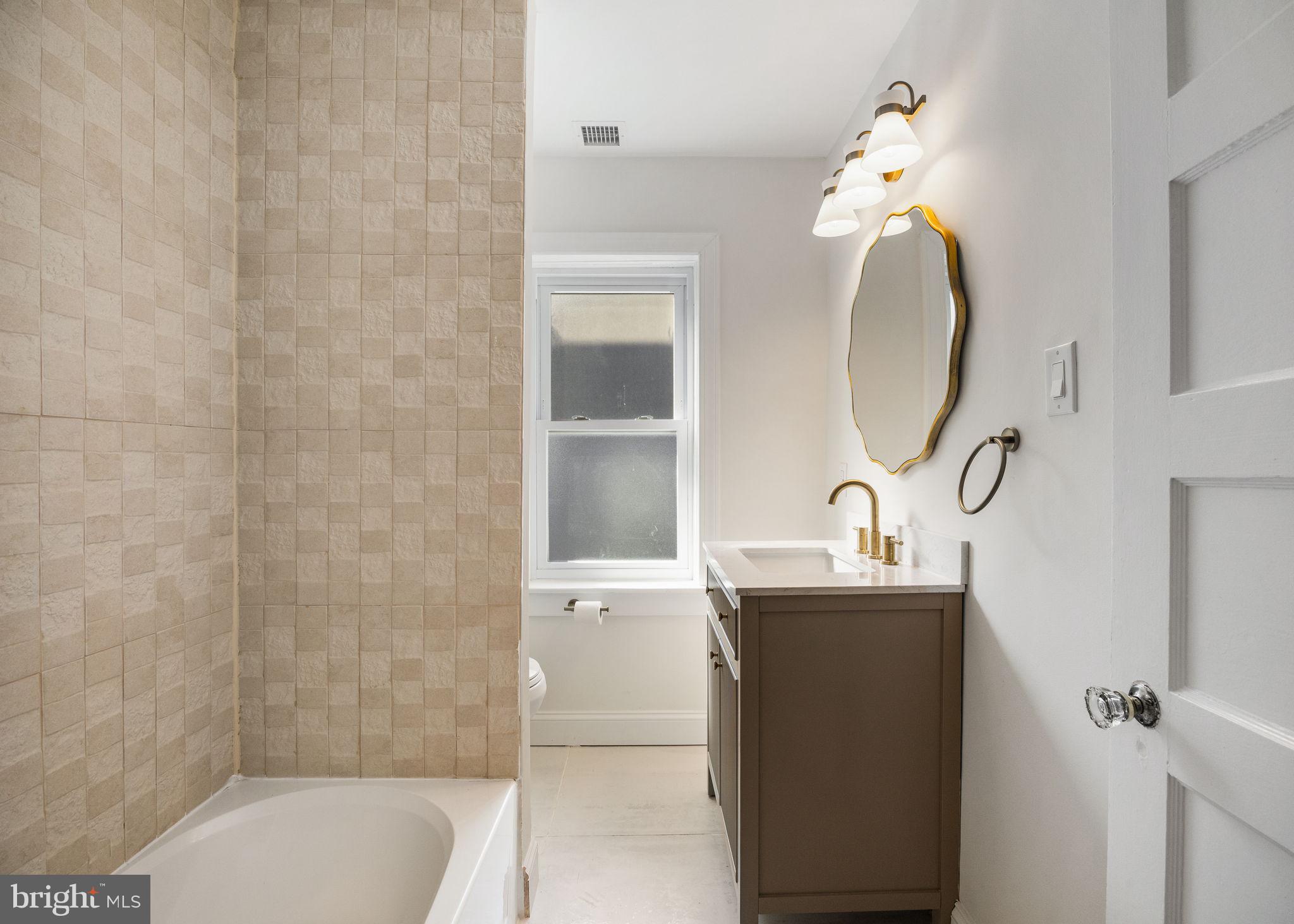 13 Princeton Road Havertown, PA 19083 - Photo 44 of 73 a bathroom with a sink a toilet and shower