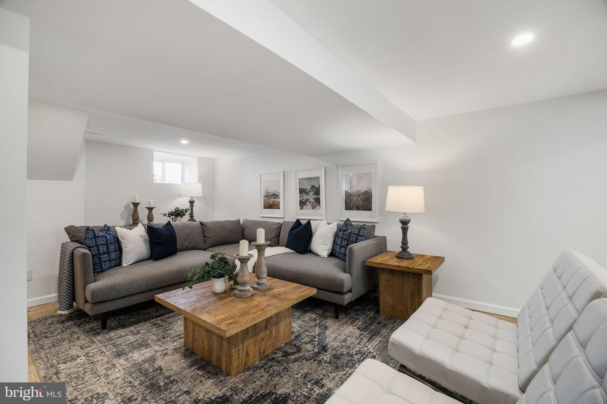 13 Princeton Road Havertown, PA 19083 - Photo 61 of 73 a living room with furniture a rug and a lamp