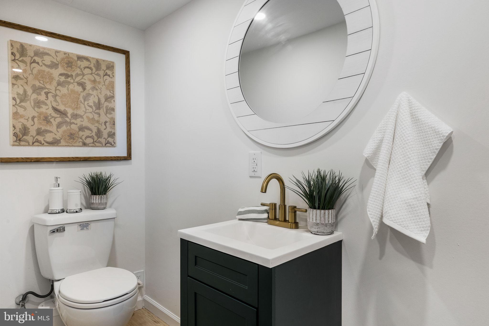 13 Princeton Road Havertown, PA 19083 - Photo 65 of 73 a bathroom with a toilet sink and mirror