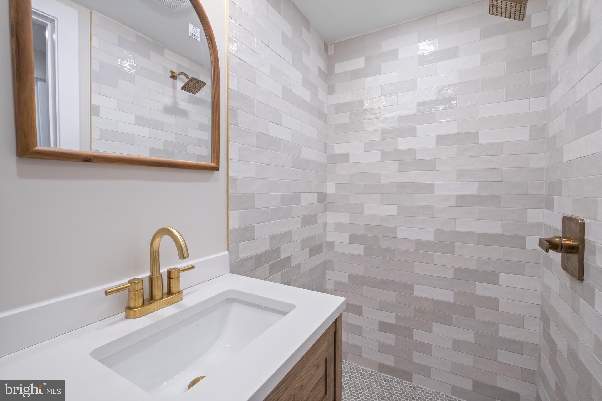 35 Michigan Avenue Northeast Washington, DC 20002 - Photo 19 of 28 a bathroom with a sink and a mirror