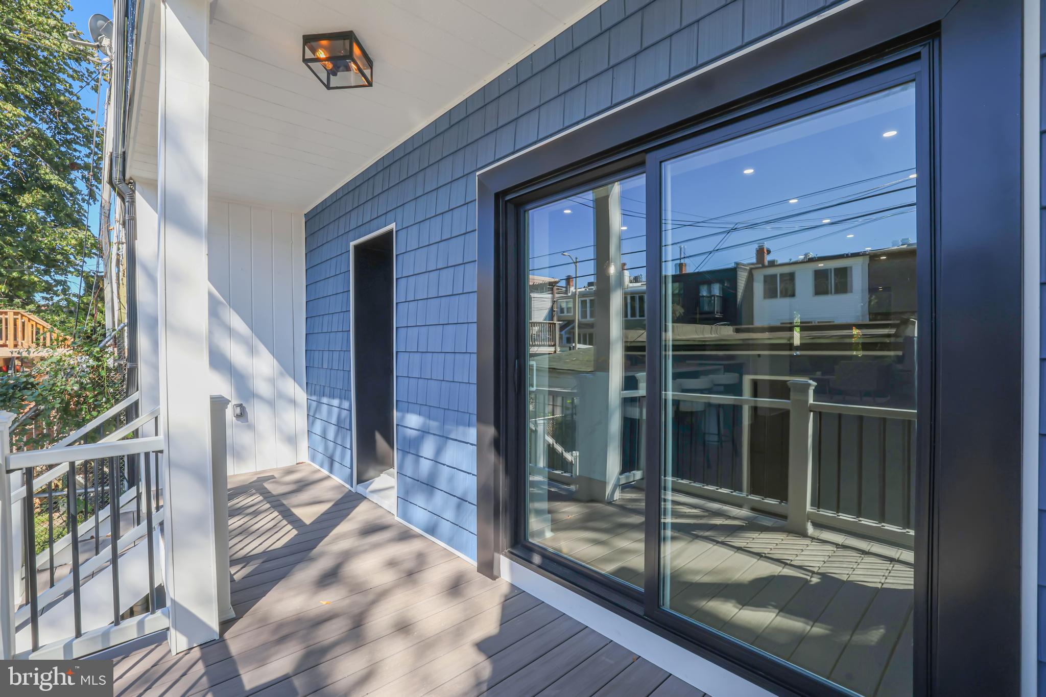 35 Michigan Avenue Northeast Washington, DC 20002 - Photo 20 of 28 a view of a porch with a floor to ceiling window and wooden floor