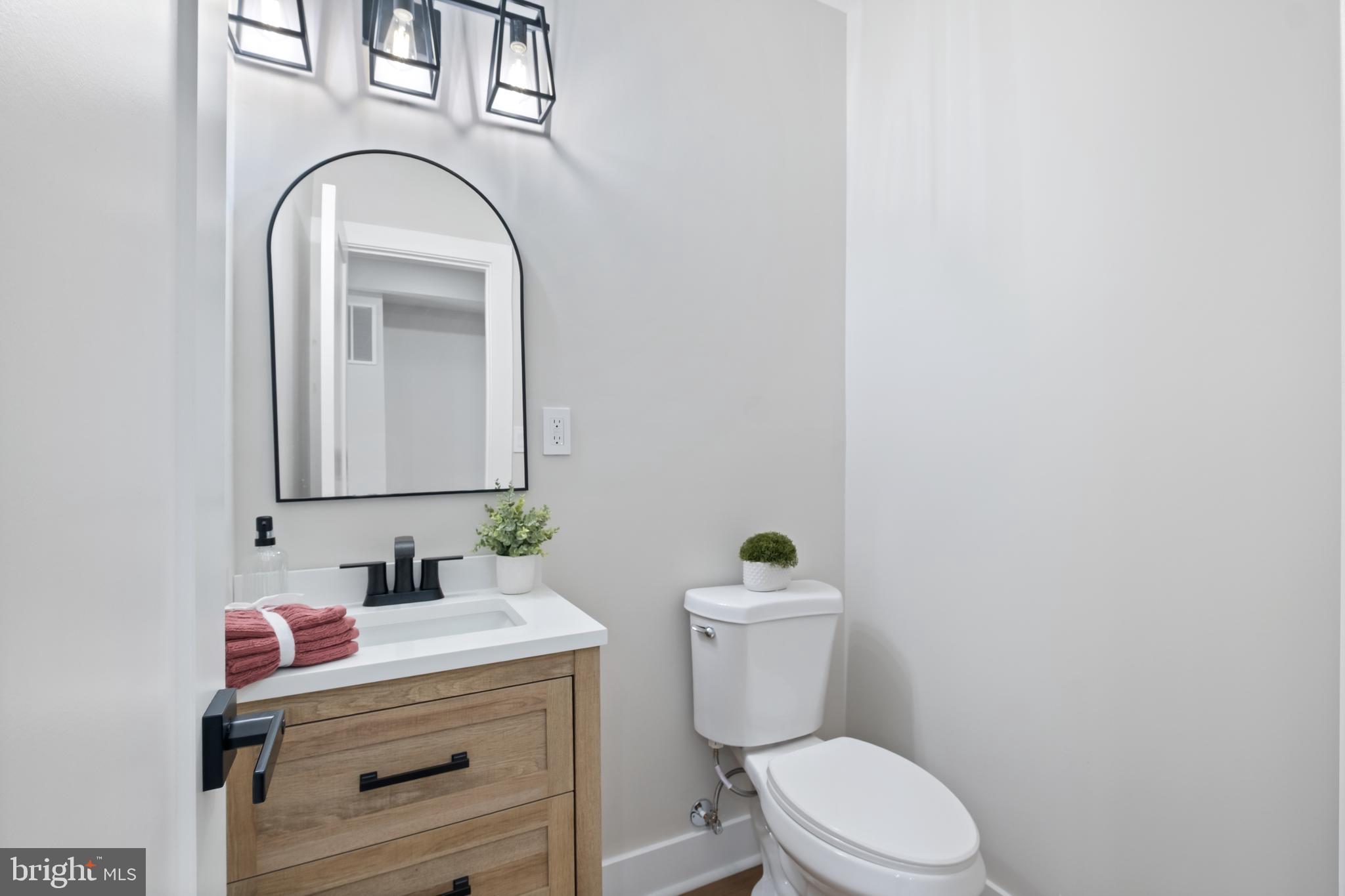 35 Michigan Avenue Northeast Washington, DC 20002 - Photo 7 of 28 a bathroom with a toilet sink and mirror