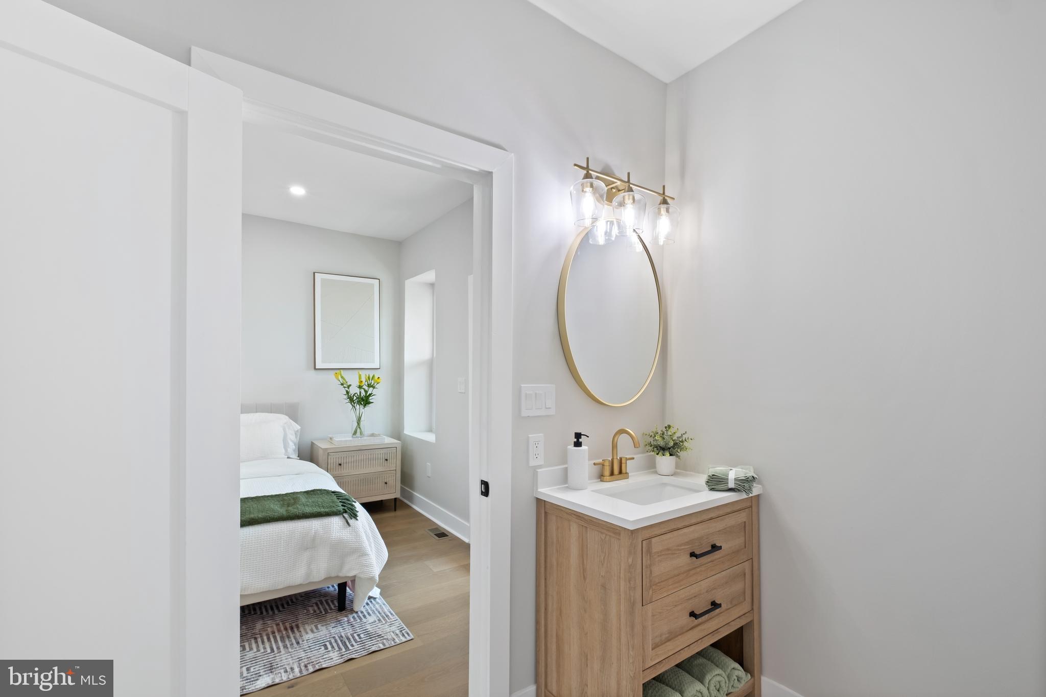 35 Michigan Avenue Northeast Washington, DC 20002 - Photo 10 of 28 a en suite bathroom with a double vanity sink and a mirror