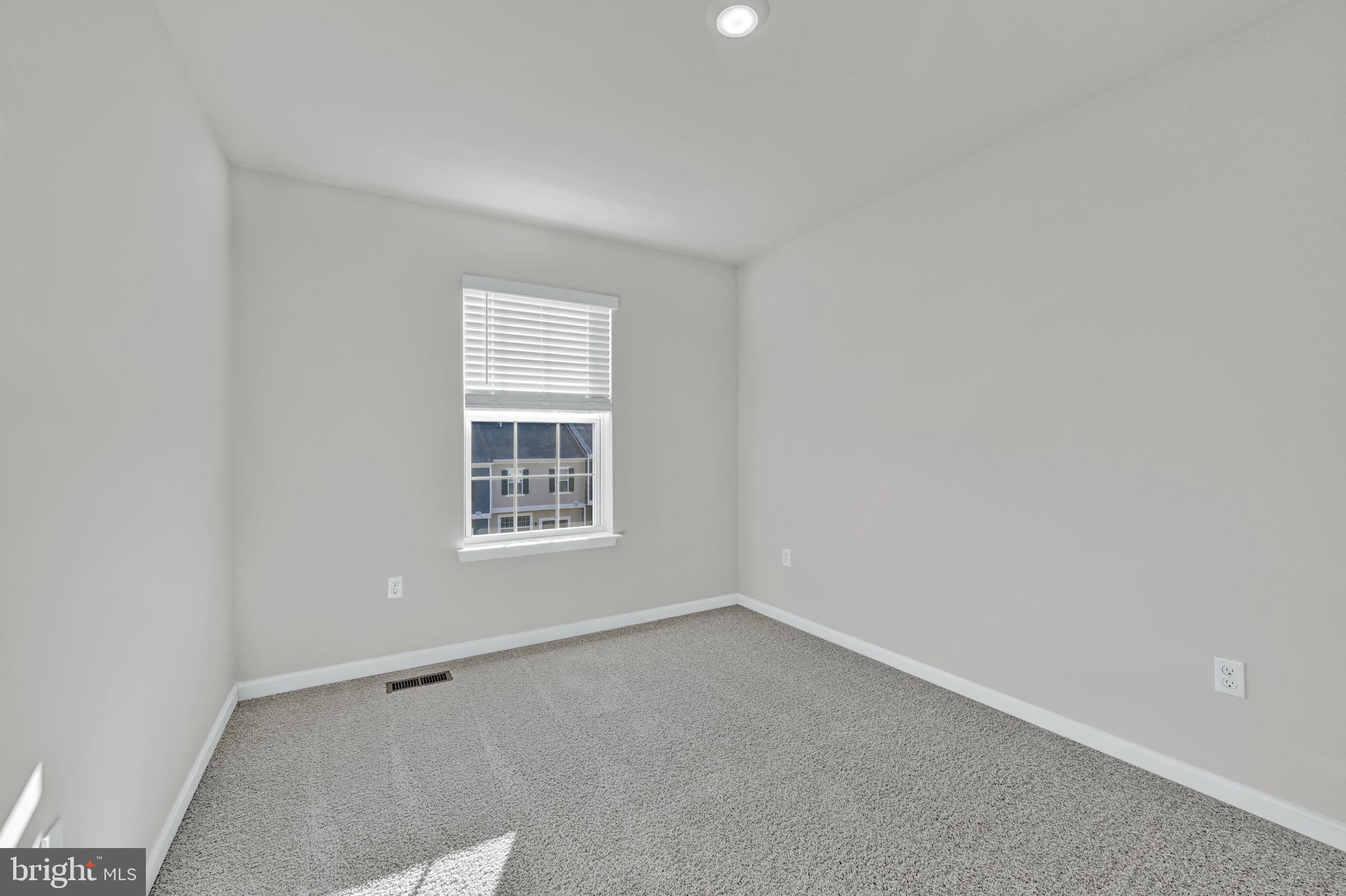 32 Merion Avenue Baltimore, MD 21237 - Photo 13 of 24 a view of an empty room with a window