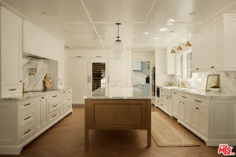a bathroom with a granite countertop sink mirror and shower