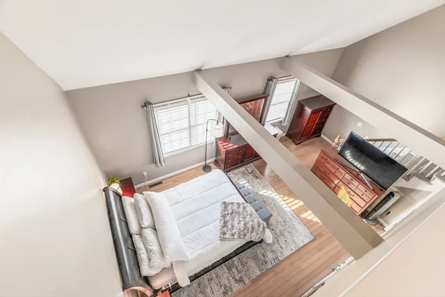 a living room with furniture and a book shelf