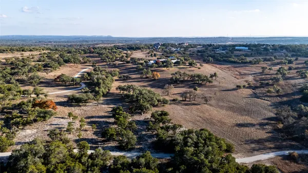an aerial view of residential building and green space