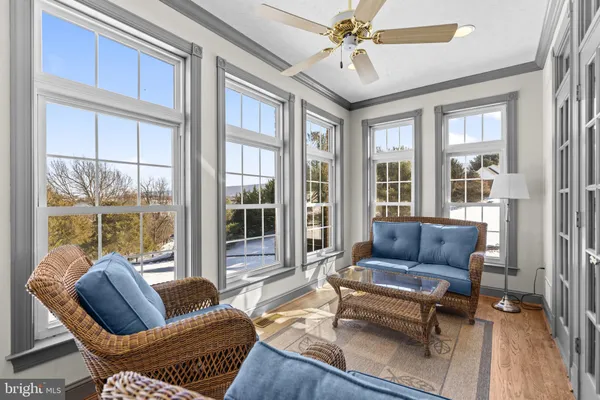 a kitchen with stainless steel appliances granite countertop a refrigerator stove top oven and large window