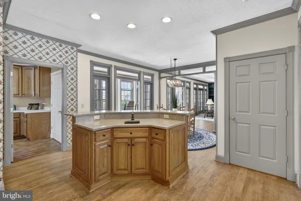 a kitchen with stainless steel appliances granite countertop a refrigerator and a stove