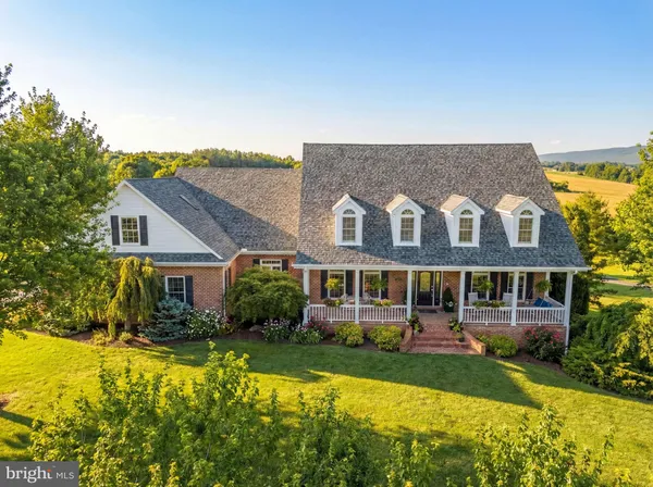 an aerial view of a house with a garden